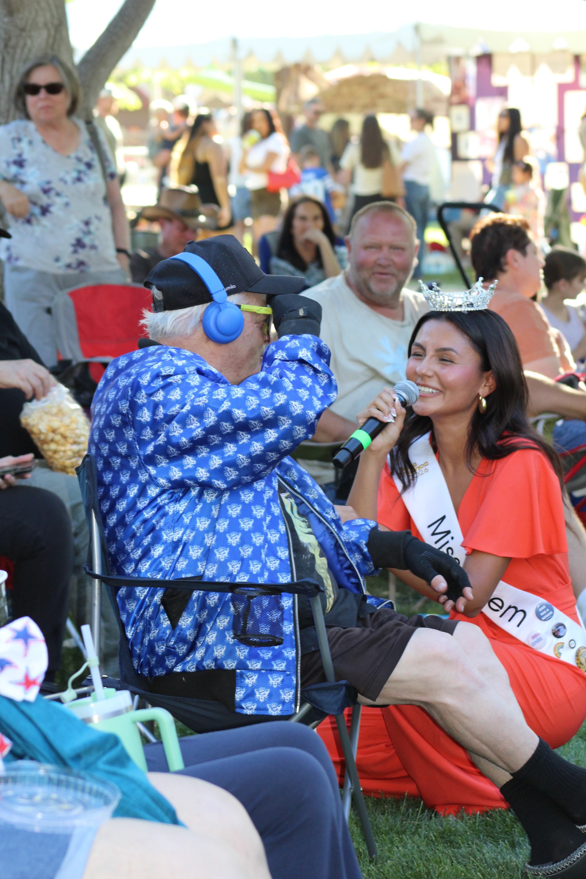 Miss Orem holding a mic for someone else