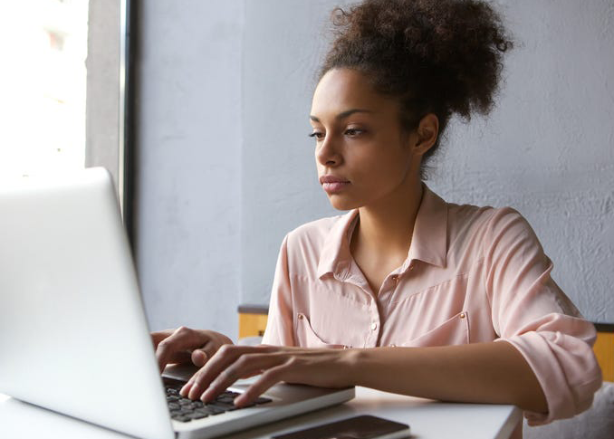 Girl typing on laptop