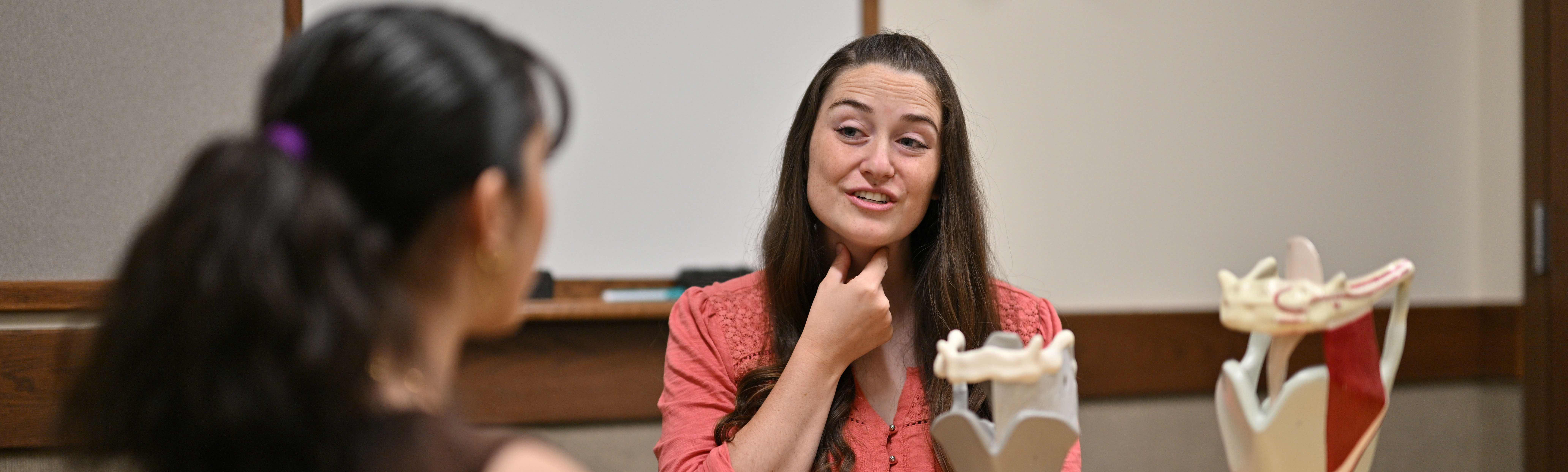 A doctor helping her patient