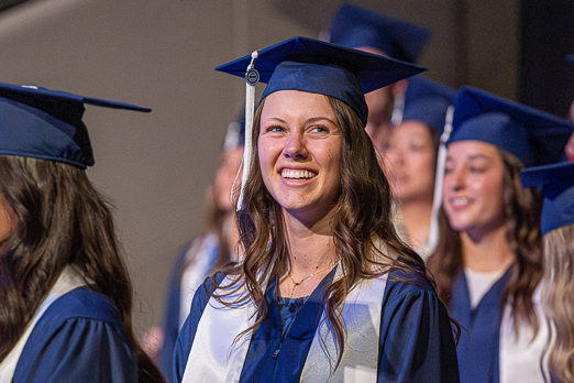 a McKay School graduate smiles at convocation