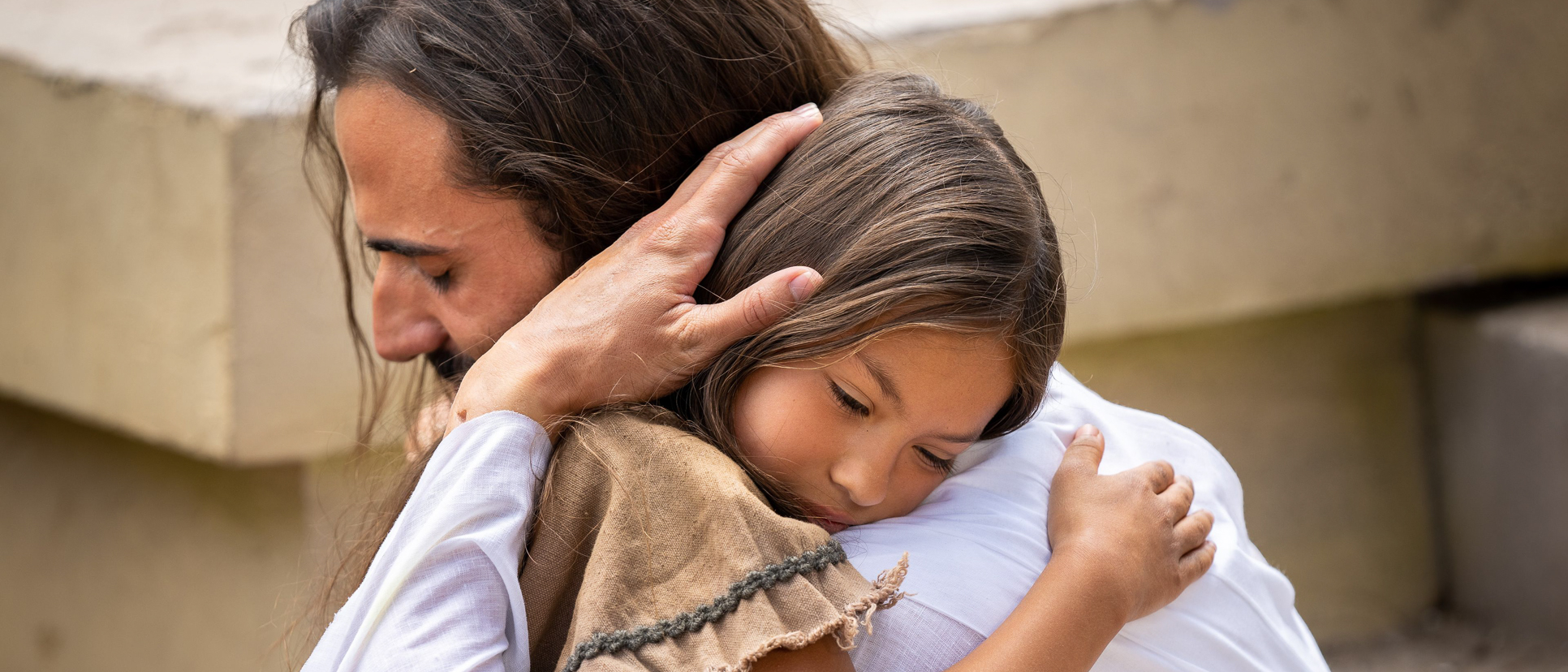 The Savior hugging a small child