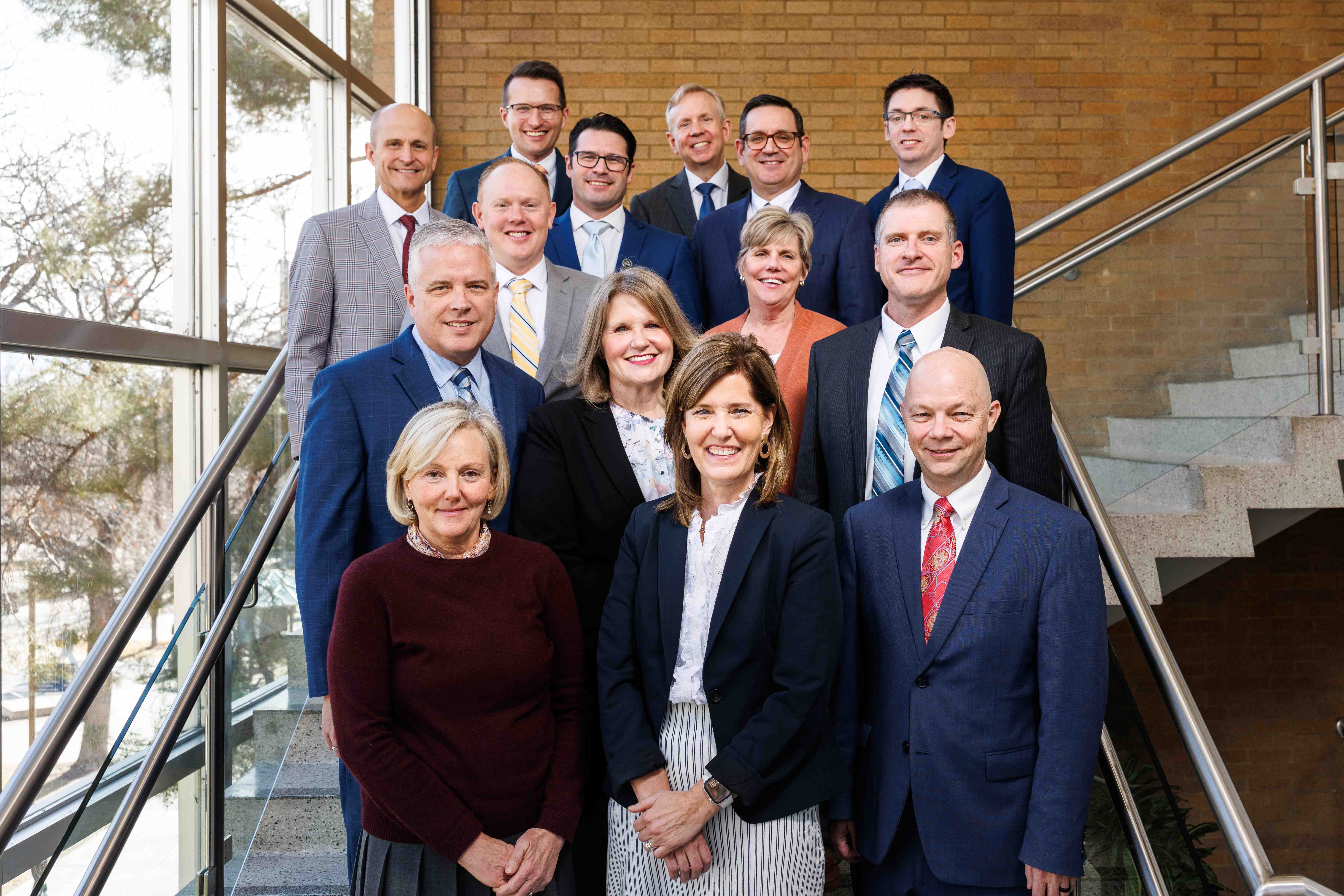 Group of Deans on stairs