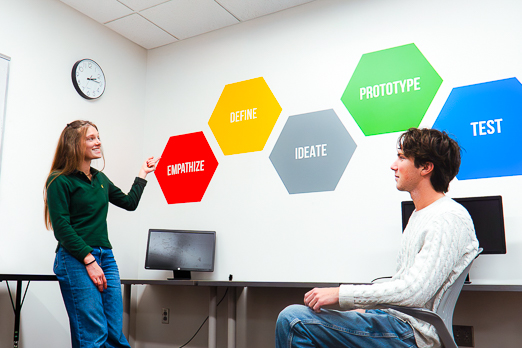 two students looking at core principles 