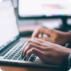 person typing on laptop
