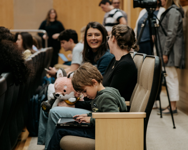 Audience members talking to eachother at the event.