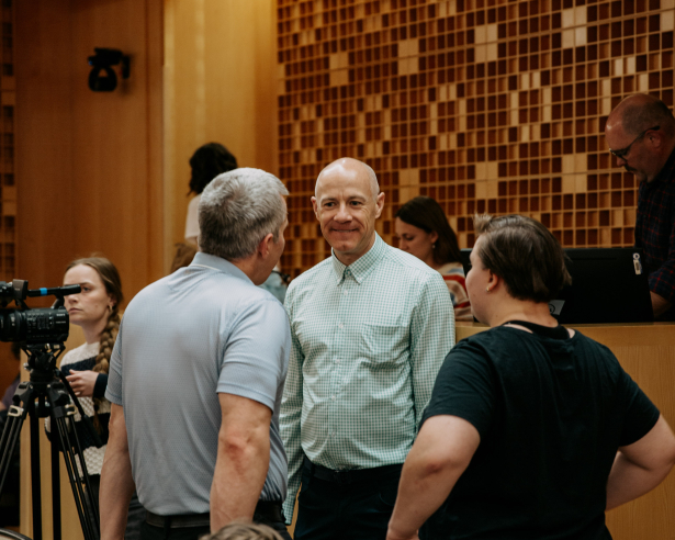Audience members talking to eachother at the event.